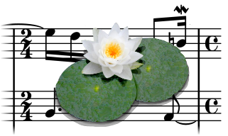 A water lily on front of a music score